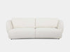 Sussex 3.5 Seater Curved Sofa in light fabric with soft rounded edges and deep cushioned seating