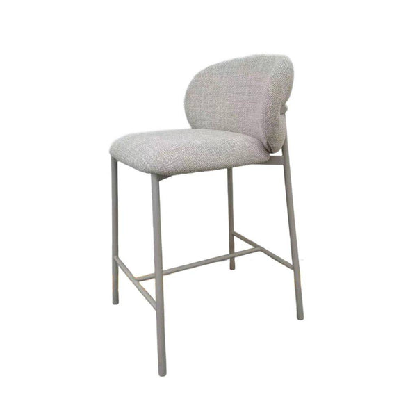 Theo Bar Chair with matte light grey steel frame and ecru fabric upholstery at kitchen island