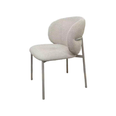Theo Dining Chair with matte grey steel frame and ecru fabric upholstery in a modern dining room