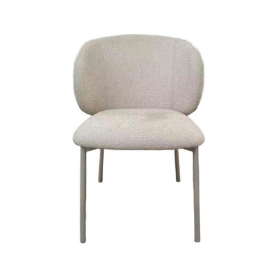 Theo Dining Chair with matte grey steel frame and ecru fabric upholstery in modern dining room