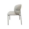 Theo Dining Chair with matte light grey steel frame and ecru fabric upholstery in modern dining room