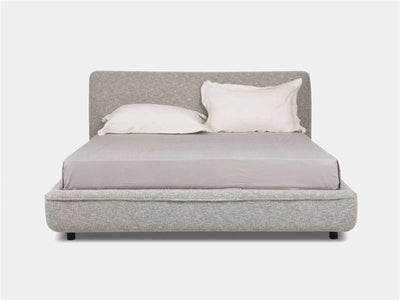 Todd Bed Frame with soft curves, upholstered silhouette, and low-profile design in a contemporary bedroom setting.