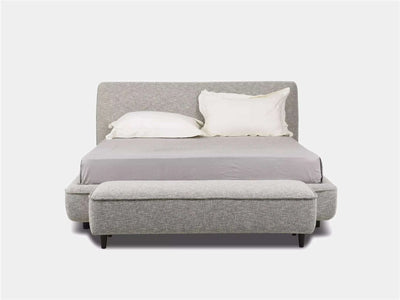 Todd Bed Frame with elegant curves in grey upholstery, showcasing a modern, minimalist design.