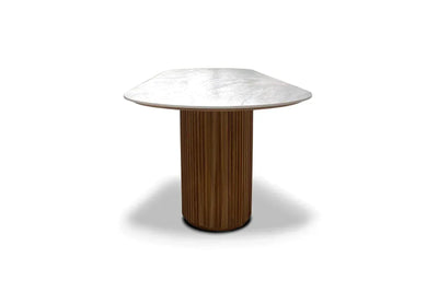 Toledo Ceramic Outdoor Dining Table with oval ceramic top and solid teak cylindrical base, weather-resistant and durable for outdoor use.