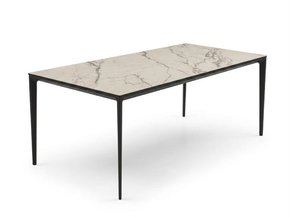 Turin Ceramic Dining Table with Spanish ceramic top and black steel base in dining room