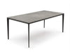 Turin ceramic dining table with Spanish ceramic top and black steel base in a modern dining room