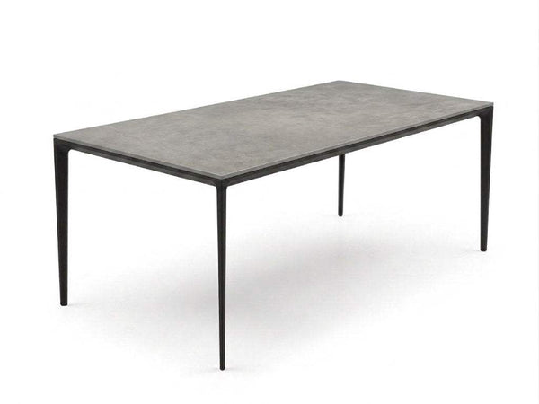 Turin ceramic dining table with Spanish ceramic top and black steel base in a modern dining room
